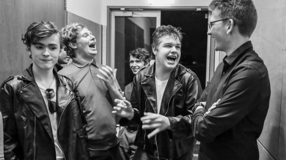 students backstage at musical show
