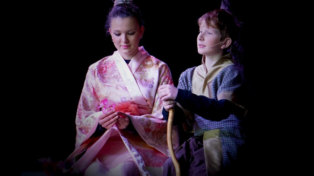 Two students performing in Mulan