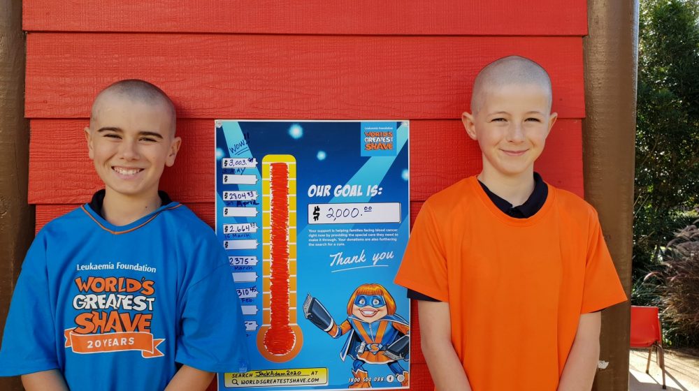 Two students with shaved heads
