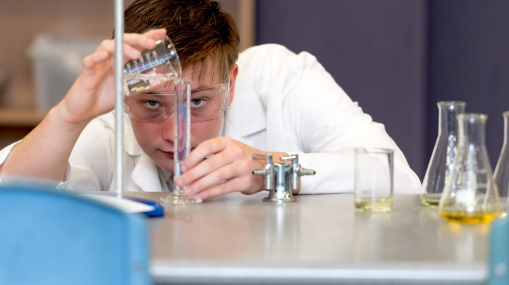 student doing a science experiment